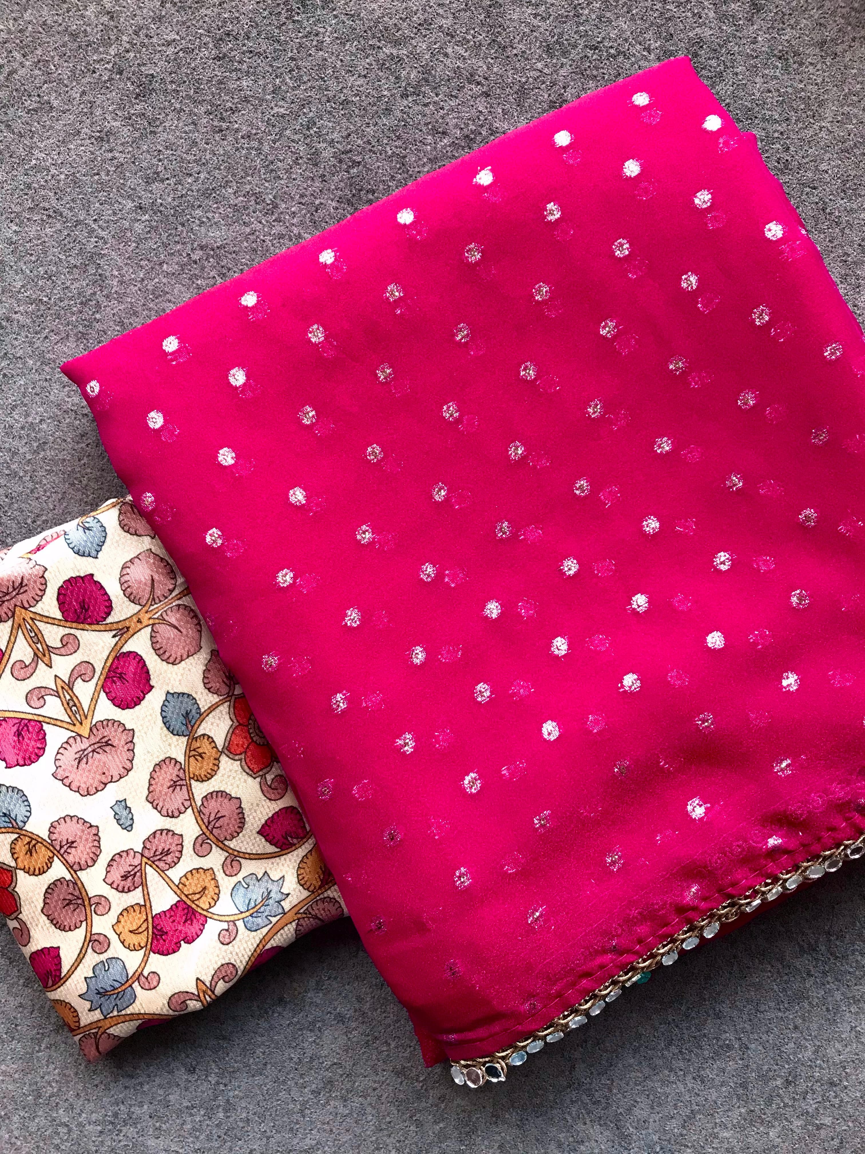 Pink fabric with polka dots and a decorative item 