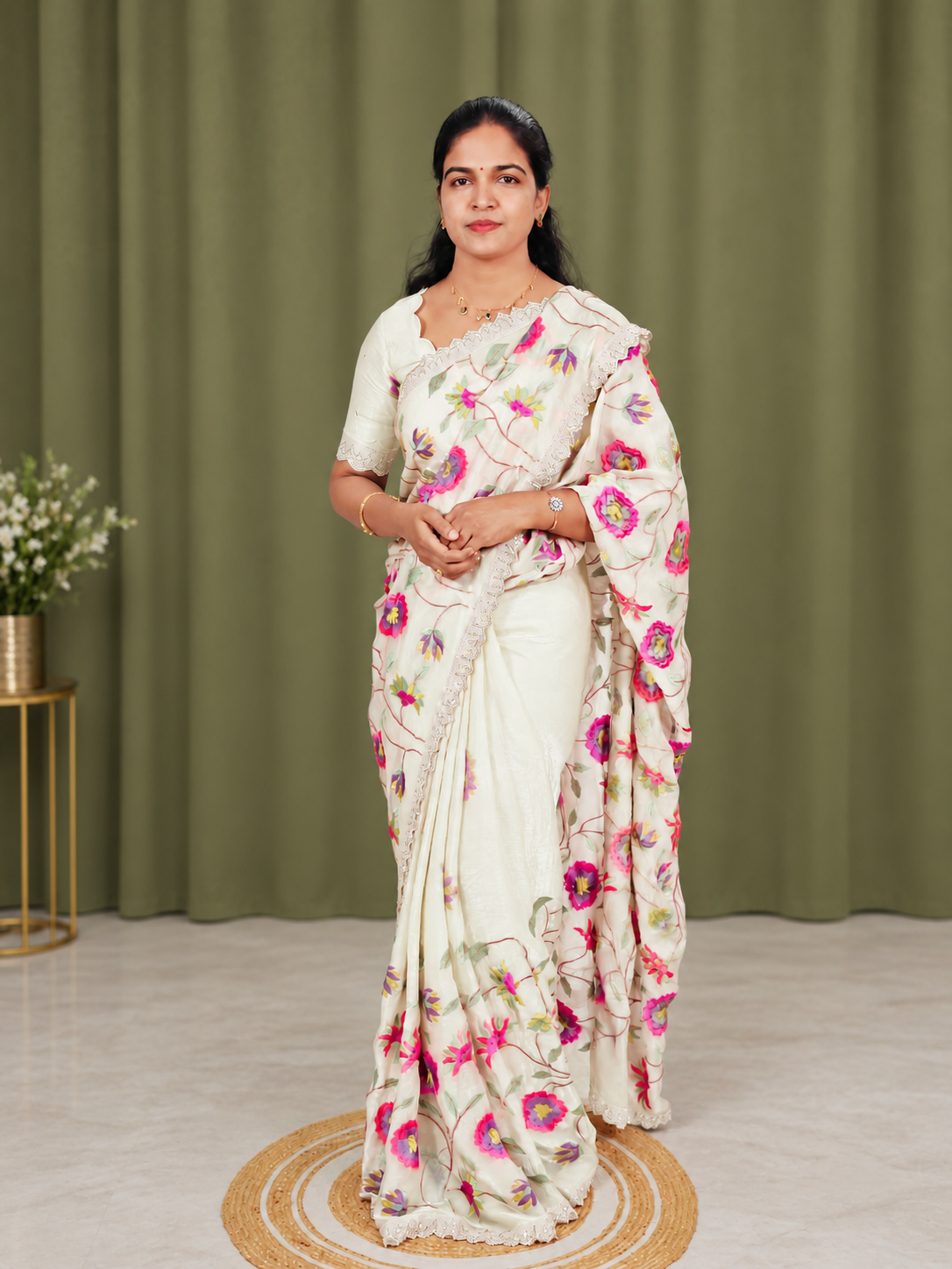A white embroidery saree with matching blouse