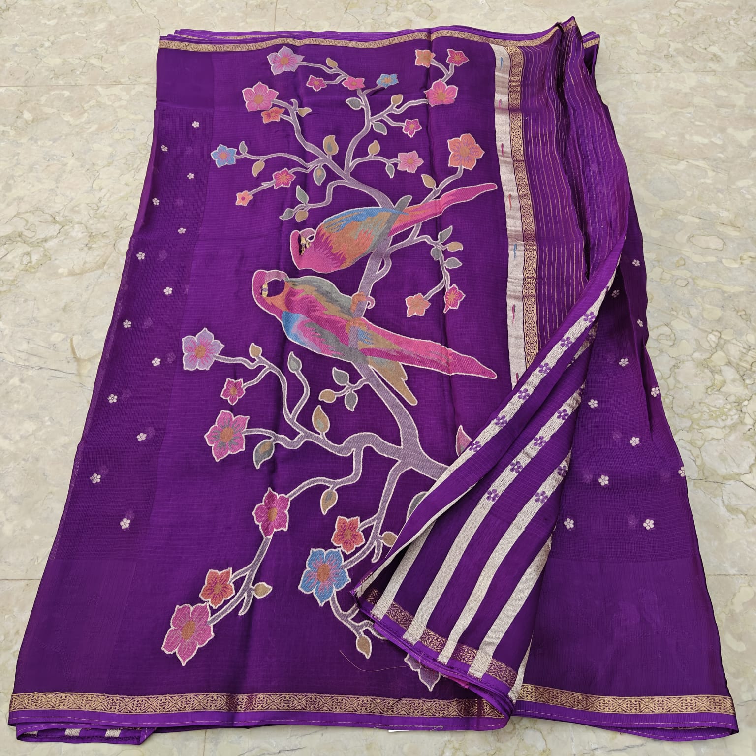 Purple saree with bird and floral patterns 