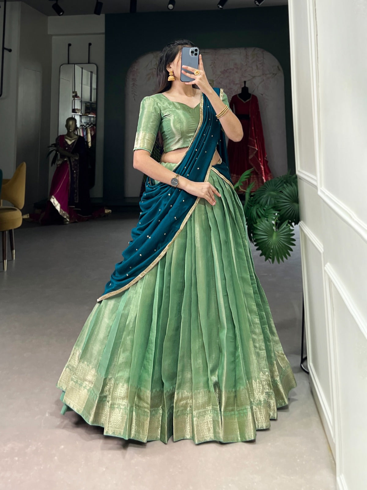 Rama Green saree with a blouse in a room.