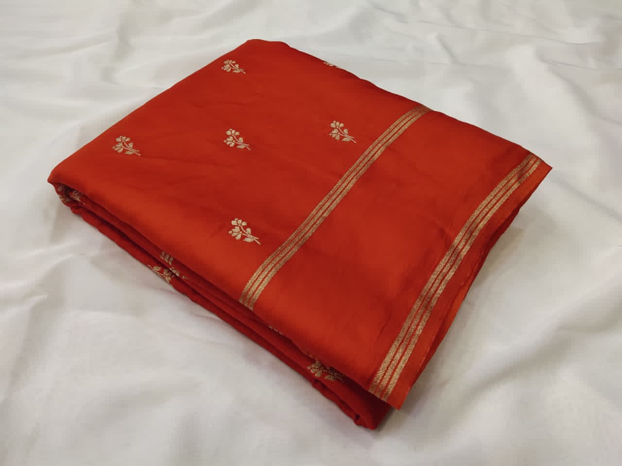 Orange fabric with embroidery work 