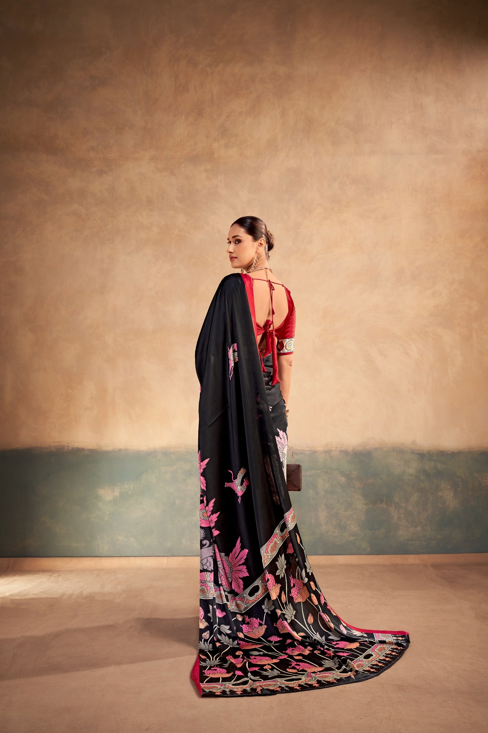 pink saree with floral patterns