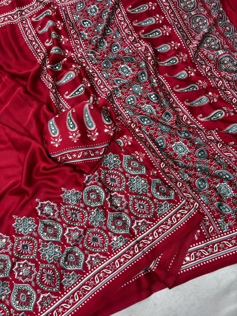 Red fabric with intricate paisley patterns