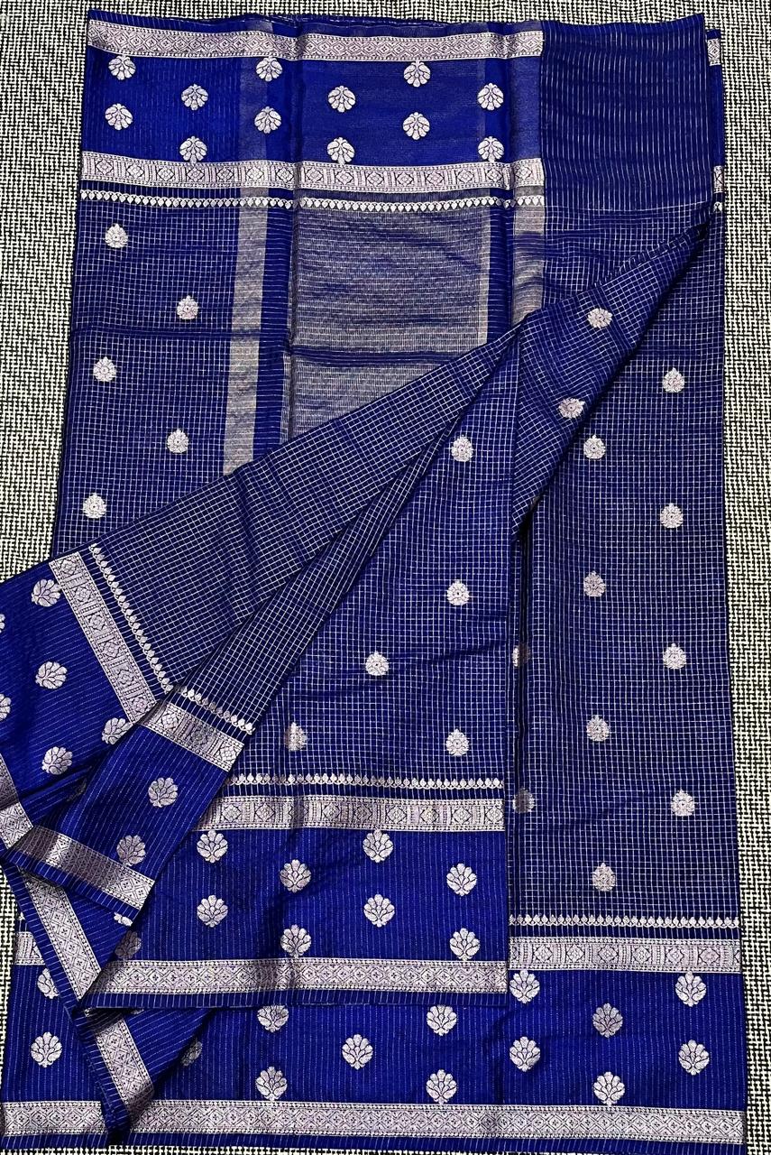 Blue saree with white patterns on a background