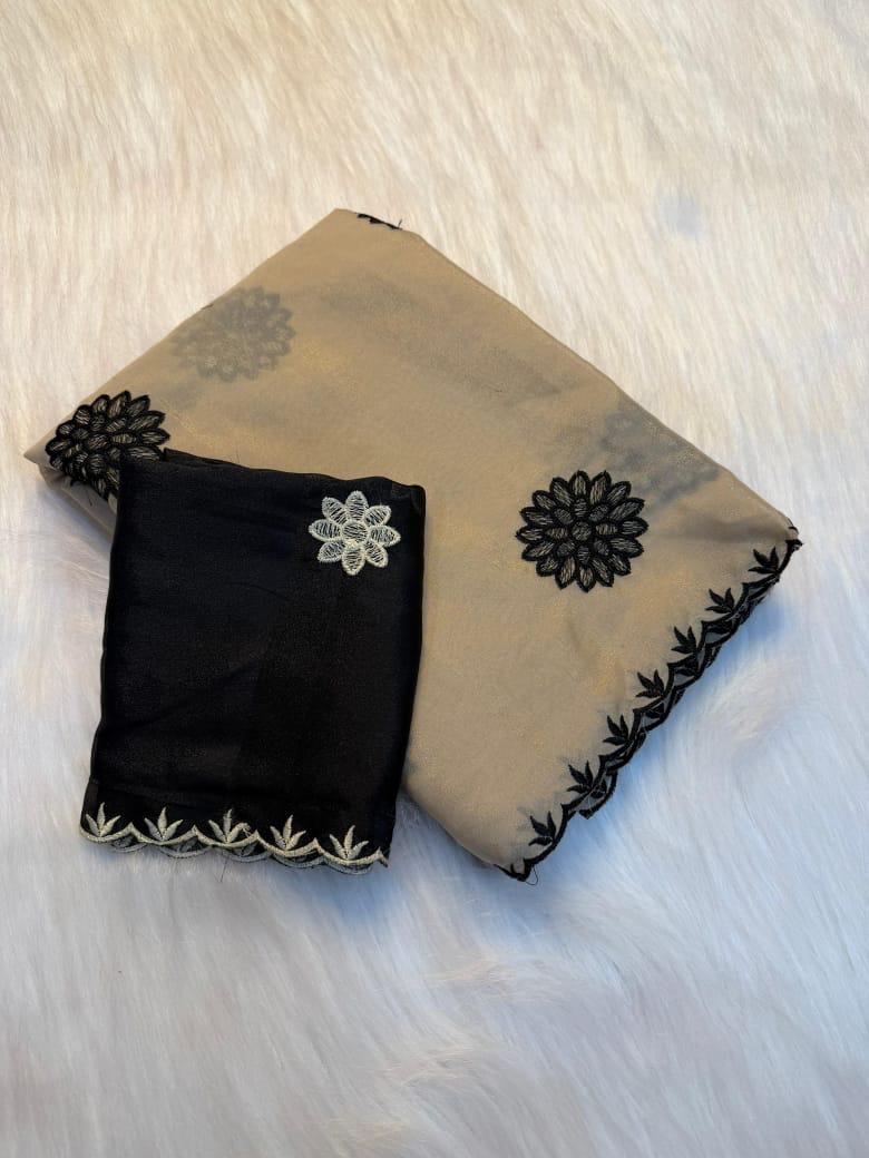 beige fabric with floral patterns on a light wooden surface