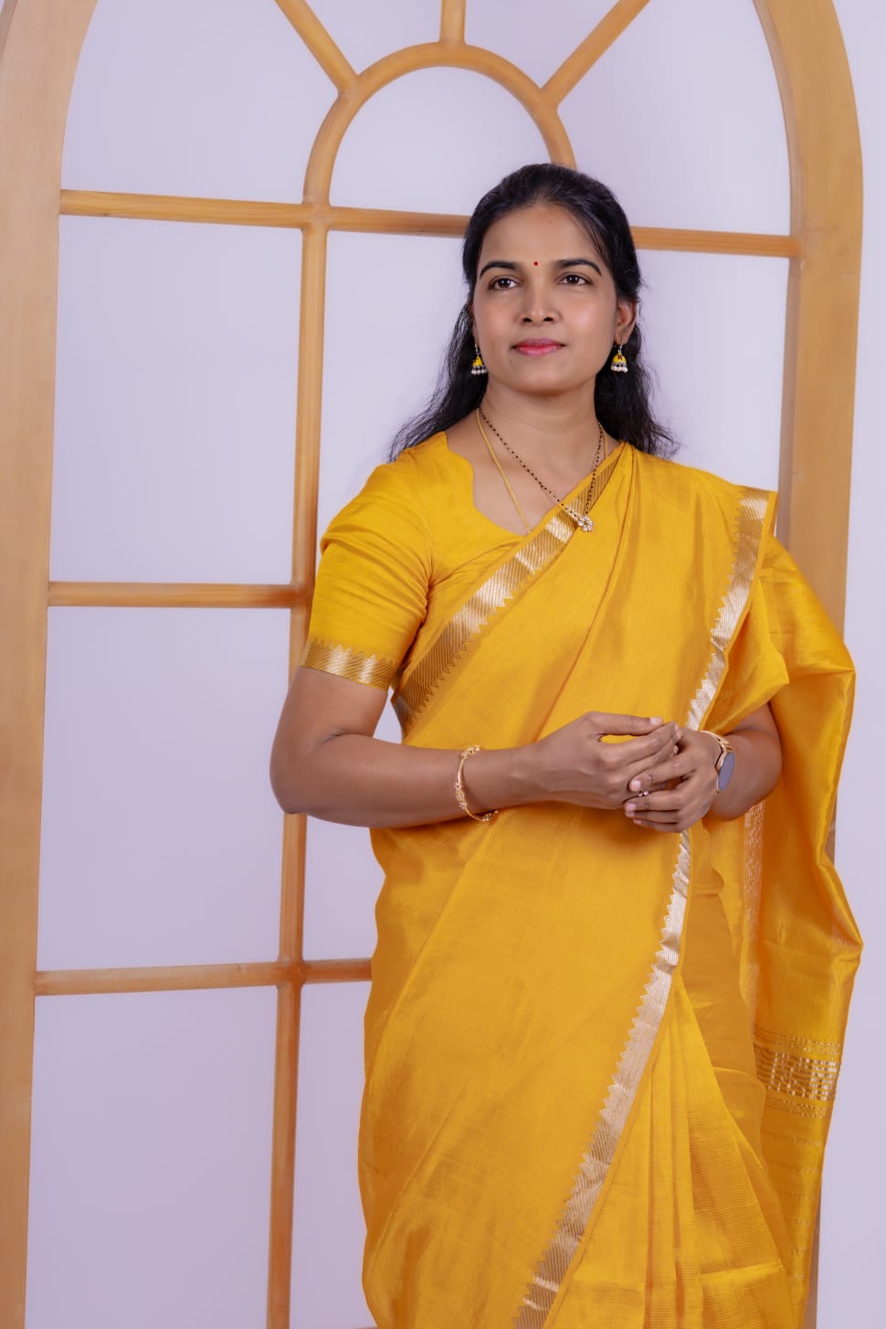 A yellow Mangalagiri Handloom pattu saree