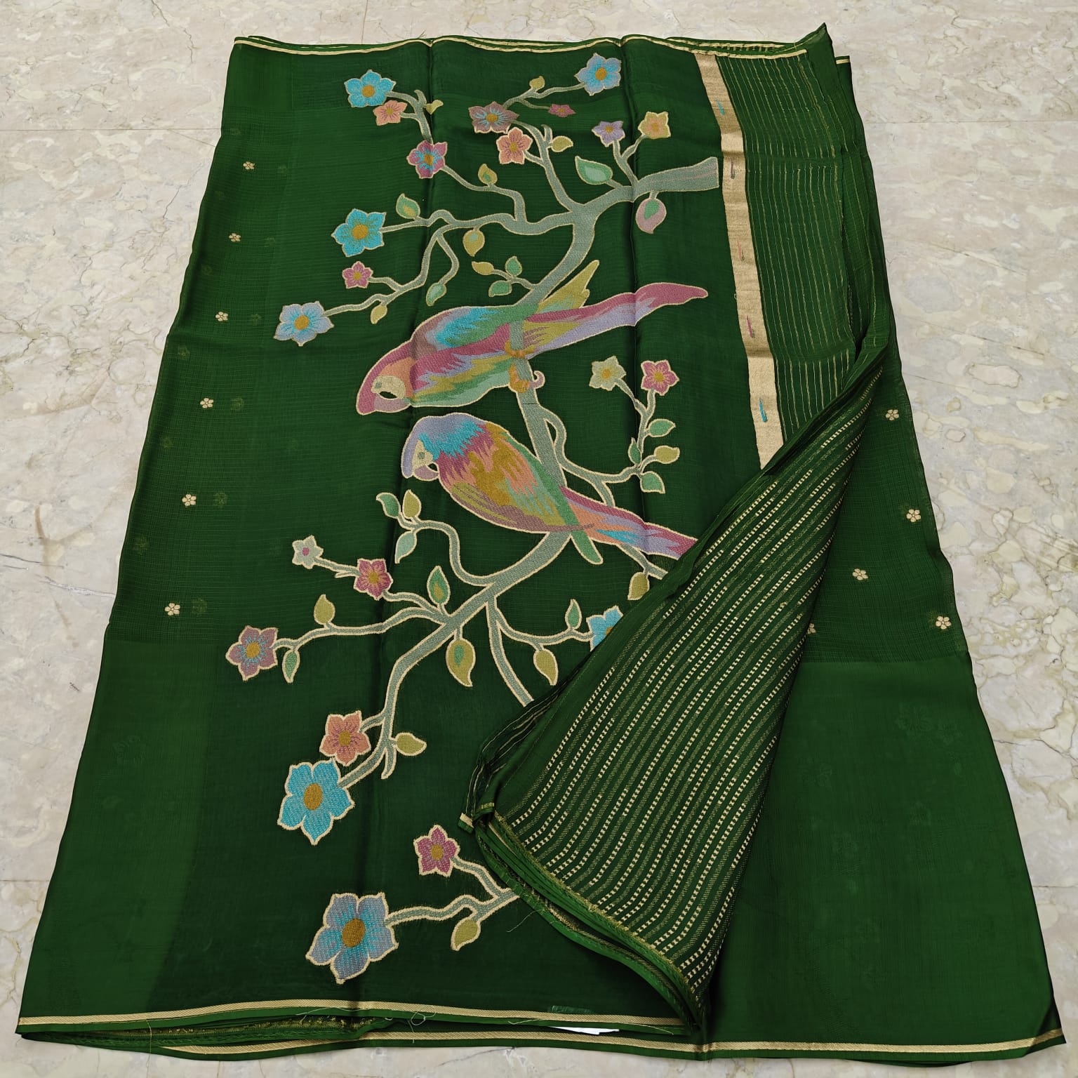 Bottle Green fabric with colorful bird and floral patterns 