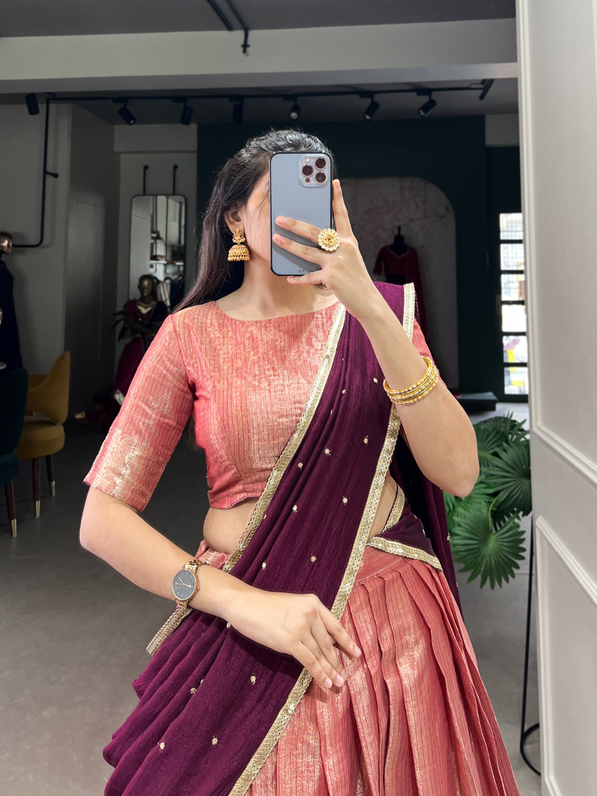 Peach saree with border.