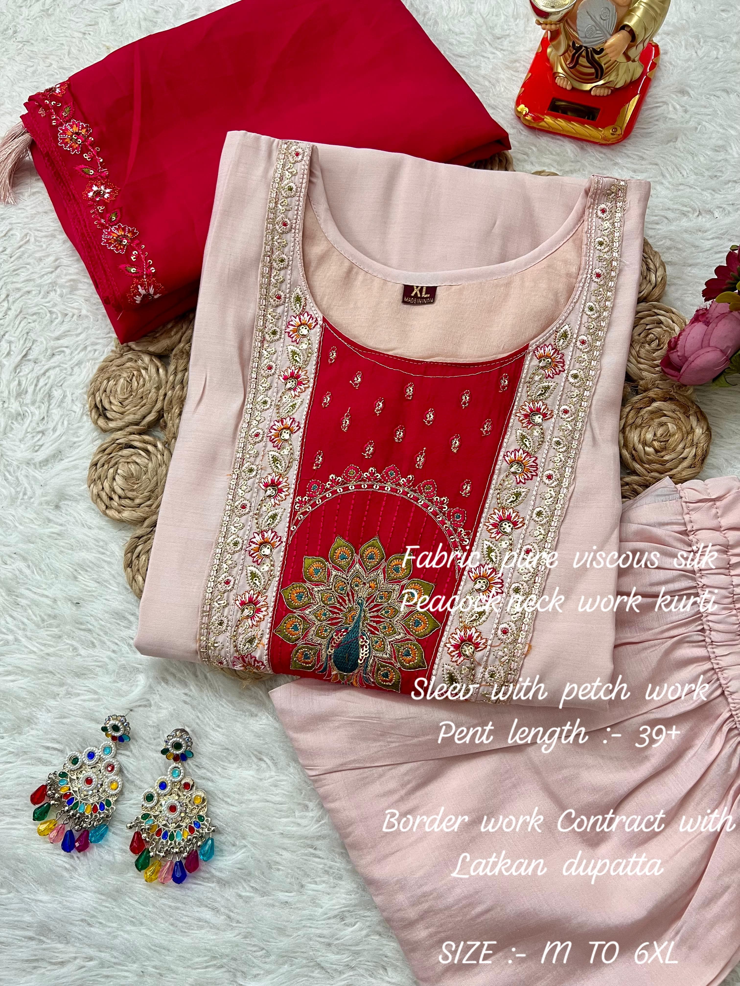 Red embroidery kurti with earrings on a white surface