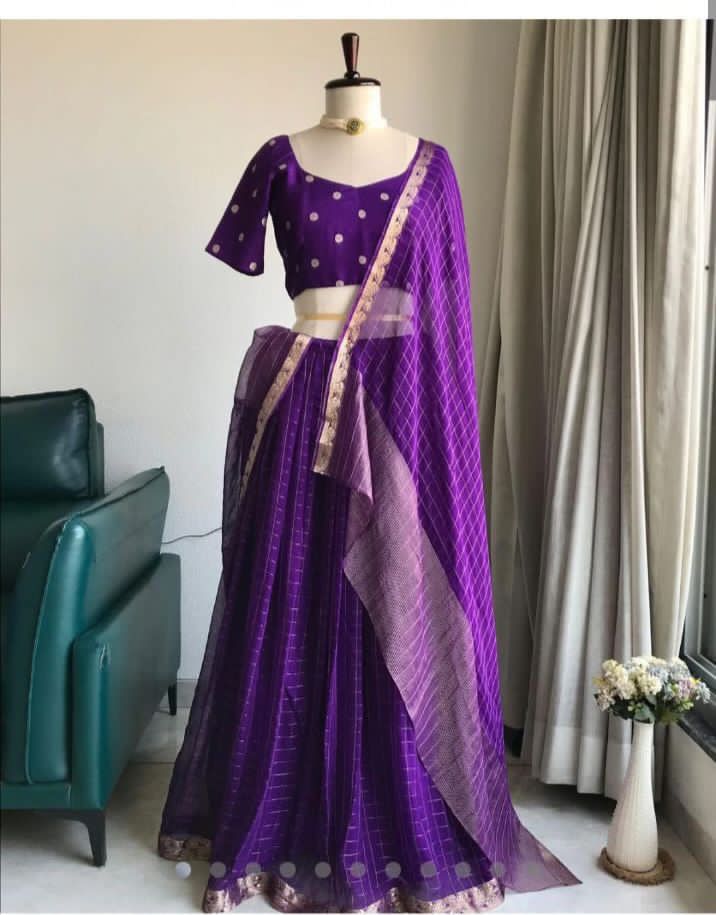 Purple traditional outfit on a mannequin against a neutral background