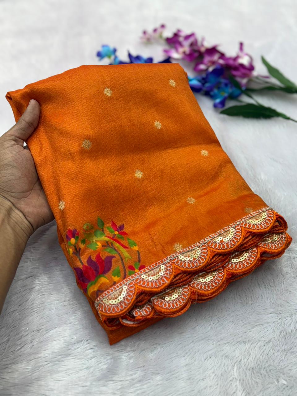 Orange saree with floral patterns 