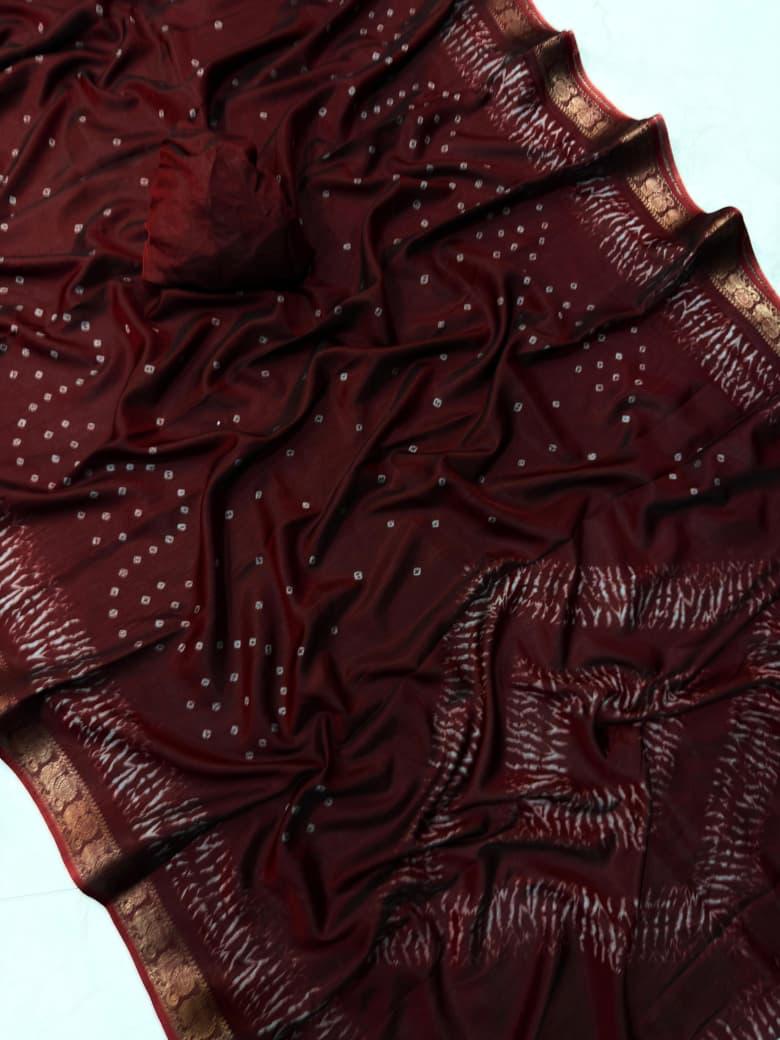 Maroon fabric with intricate patterns