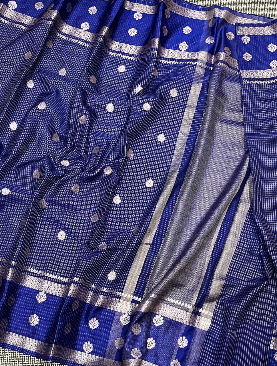 Blue fabric with white patterns and borders