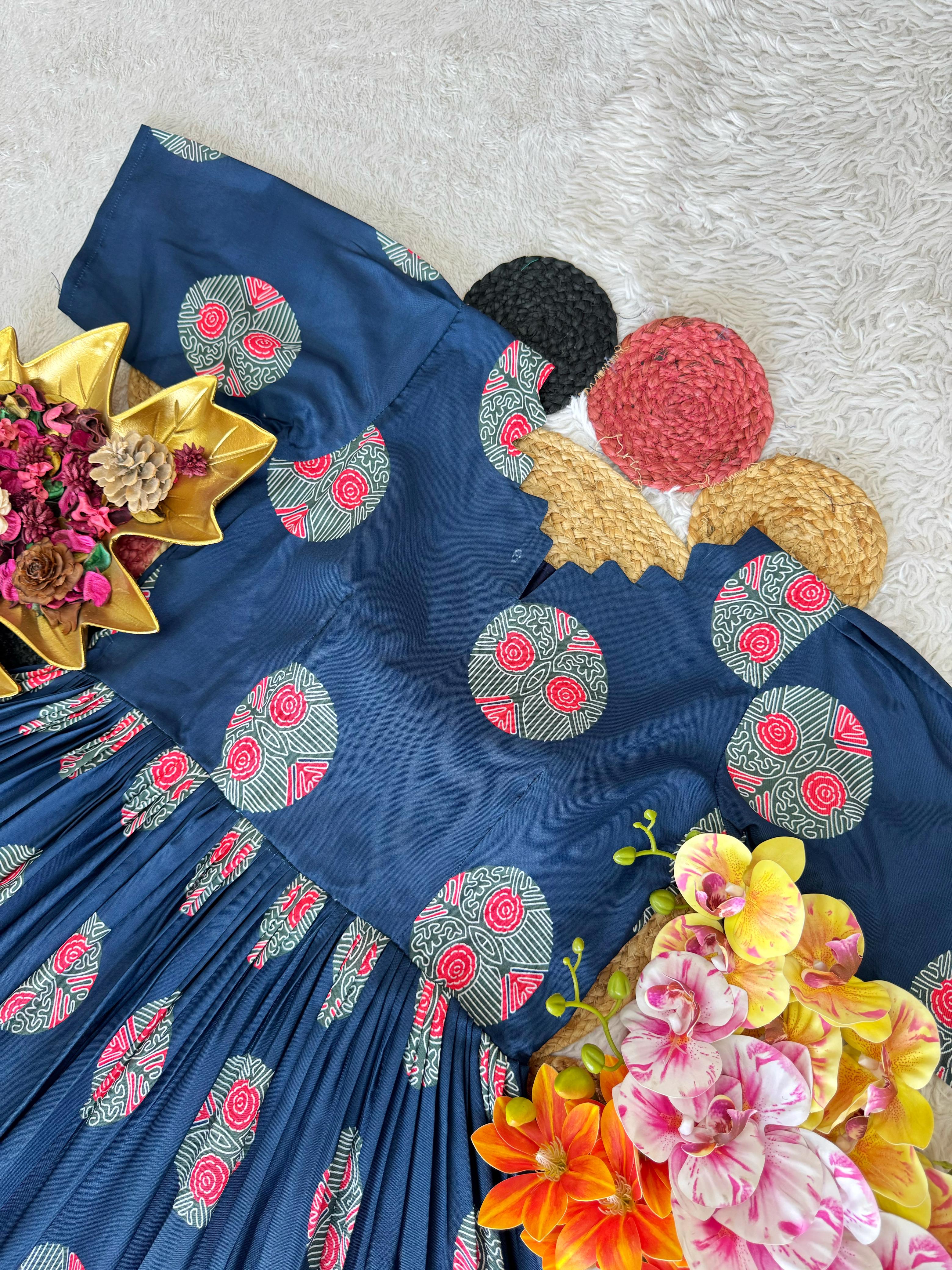 Blue embroiderey fabric with floral patterns on a textured surface