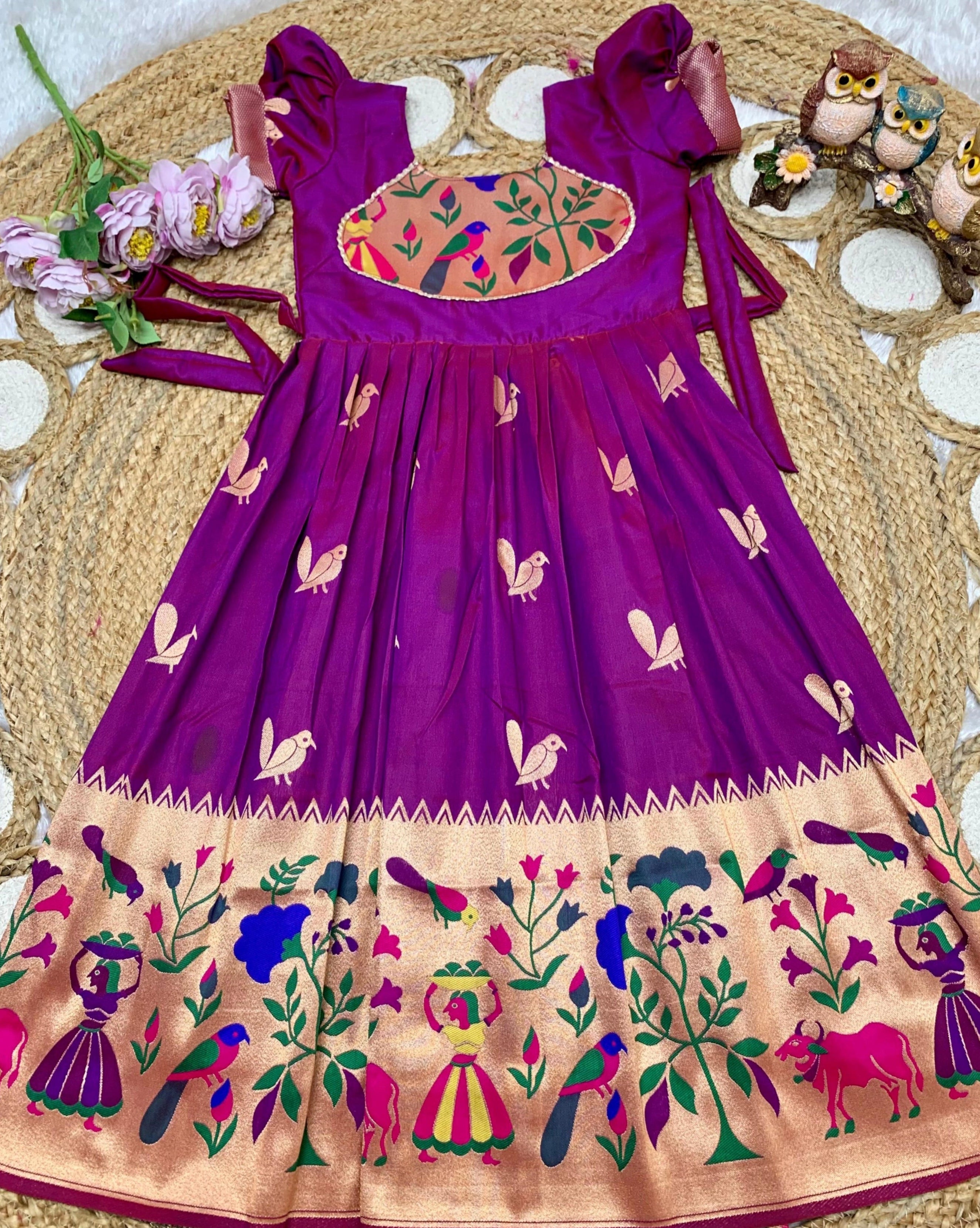 Light Purple embroidery dress on a texture surface with decorative elements.