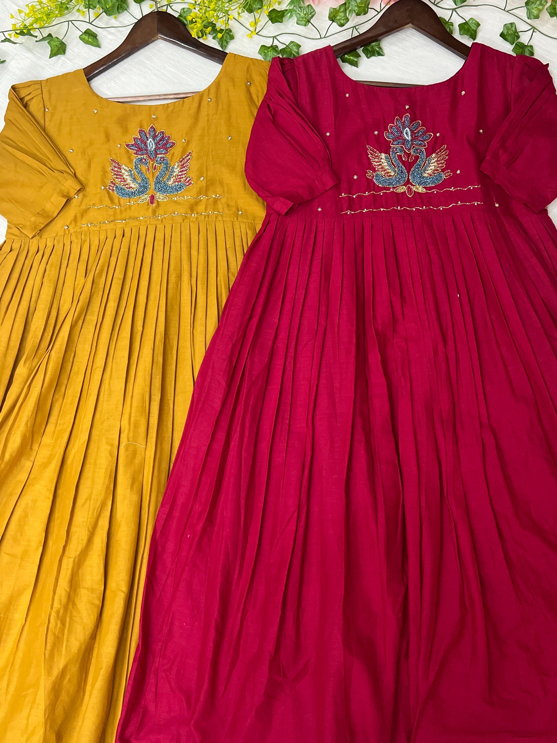 Mustard yellow and pink with floral embroidery work