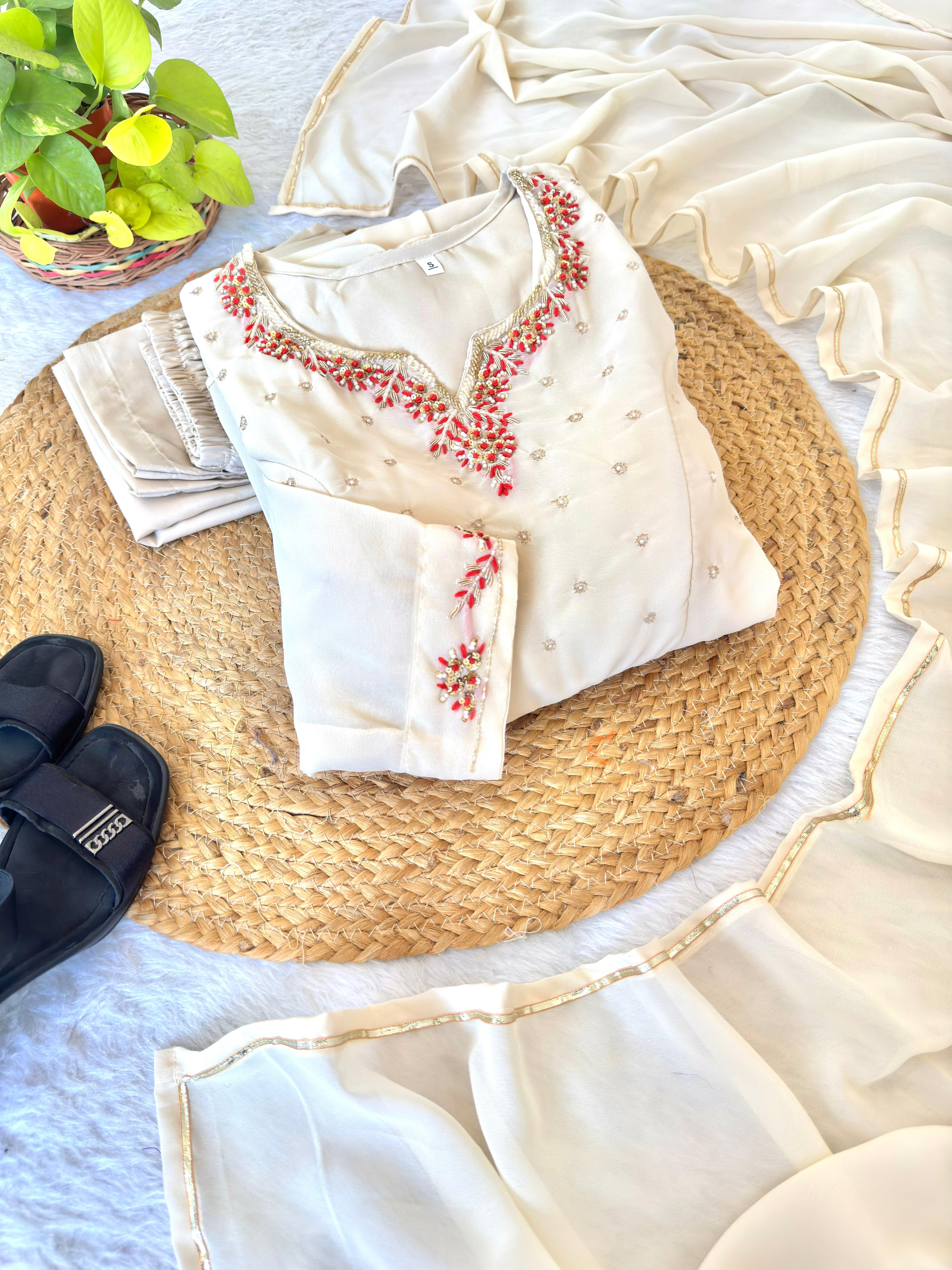 Beige traditional outfit with floral patterns 