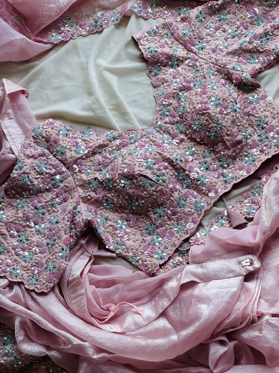 Blush Pink embroidered fabric with floral patterns on a white background