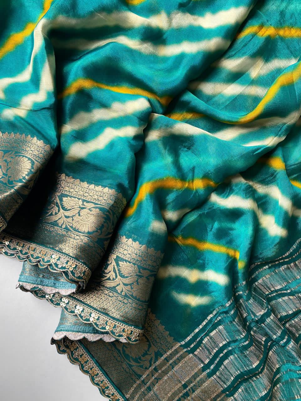 Rama green fabric with white patterns on a white background