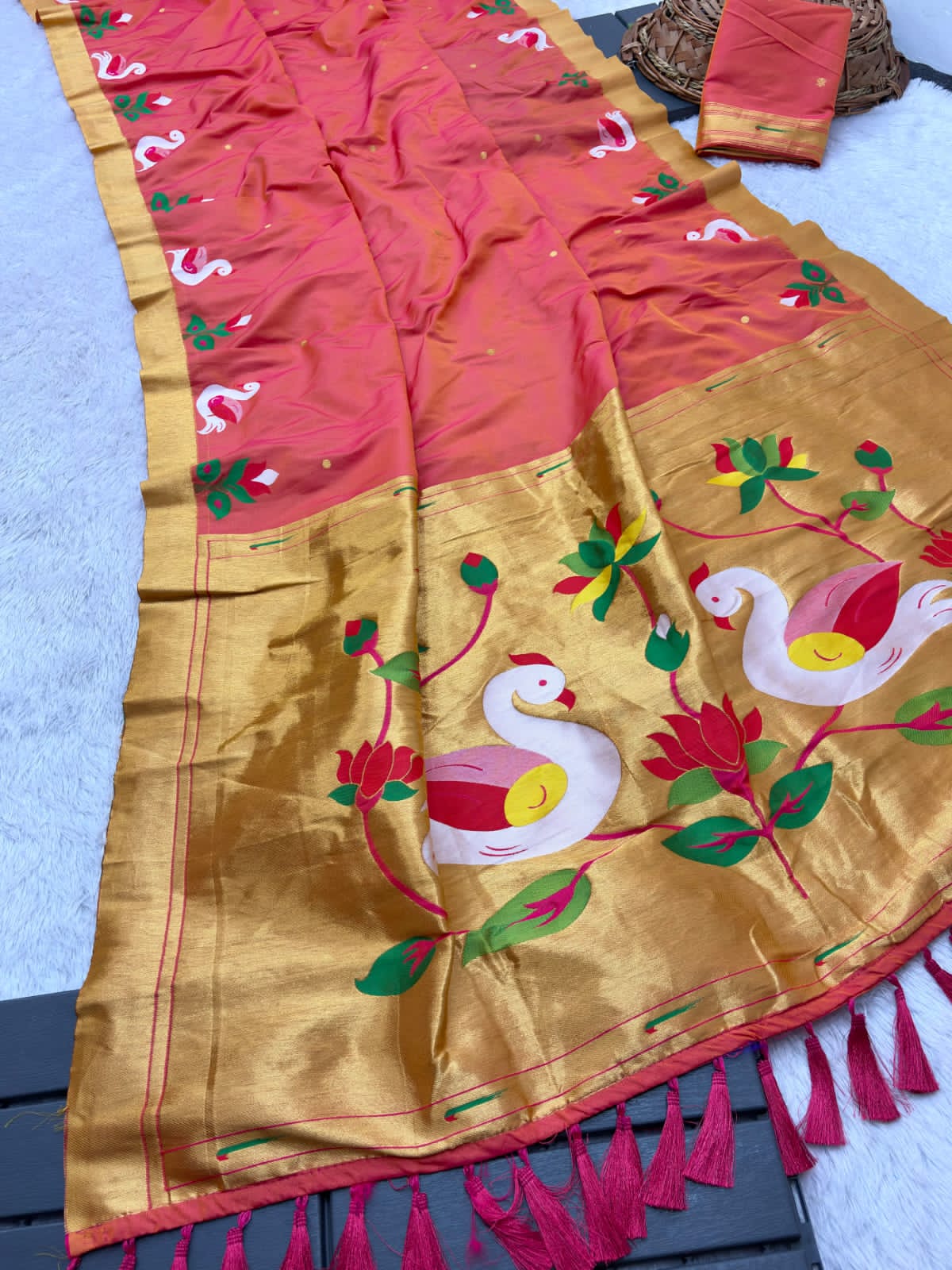 Red Saree with floral and bird patterns on a background