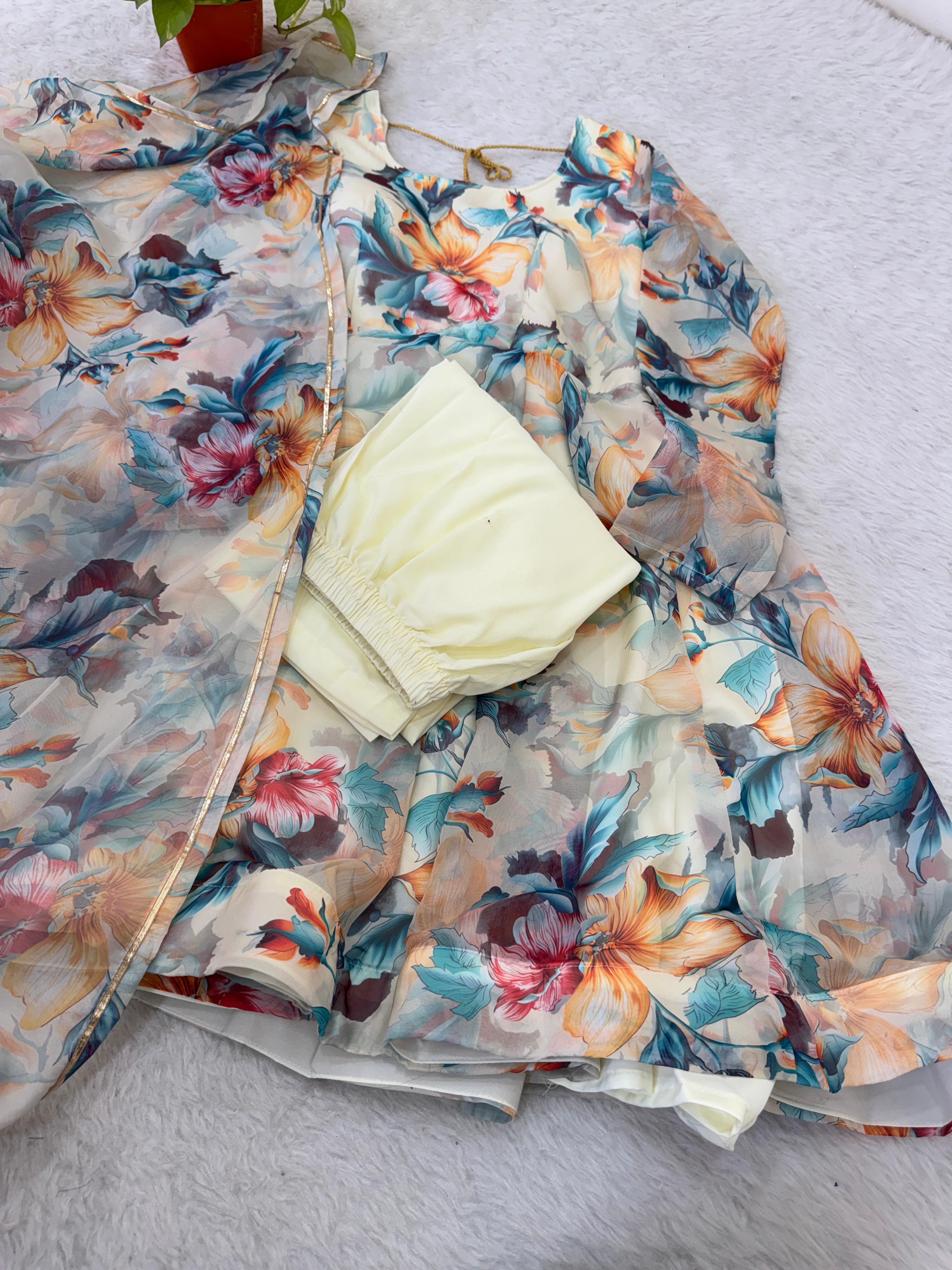 Beige Floral-patterned fabric with a stack oftowels on a light gray surface