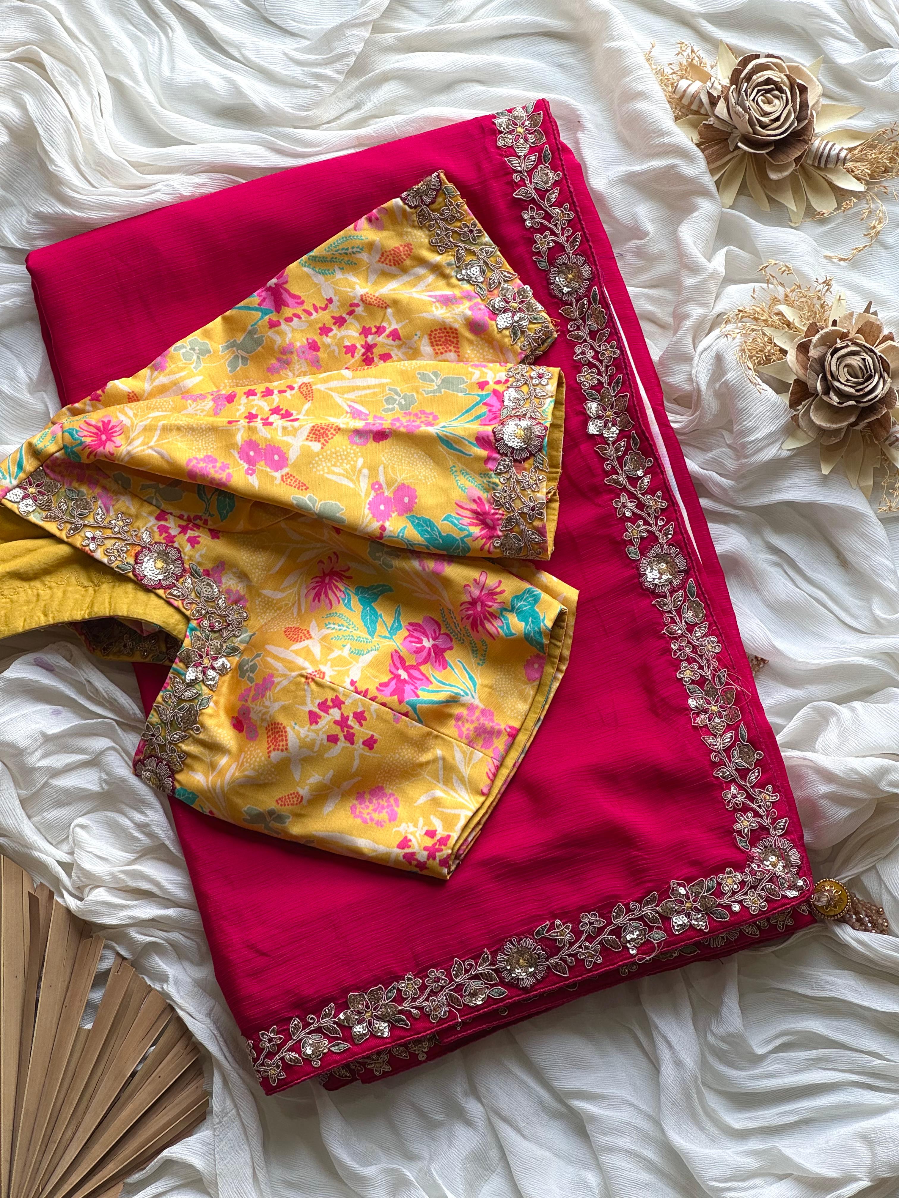 Pink saree with floral patterns and pink border with yellow blouse 