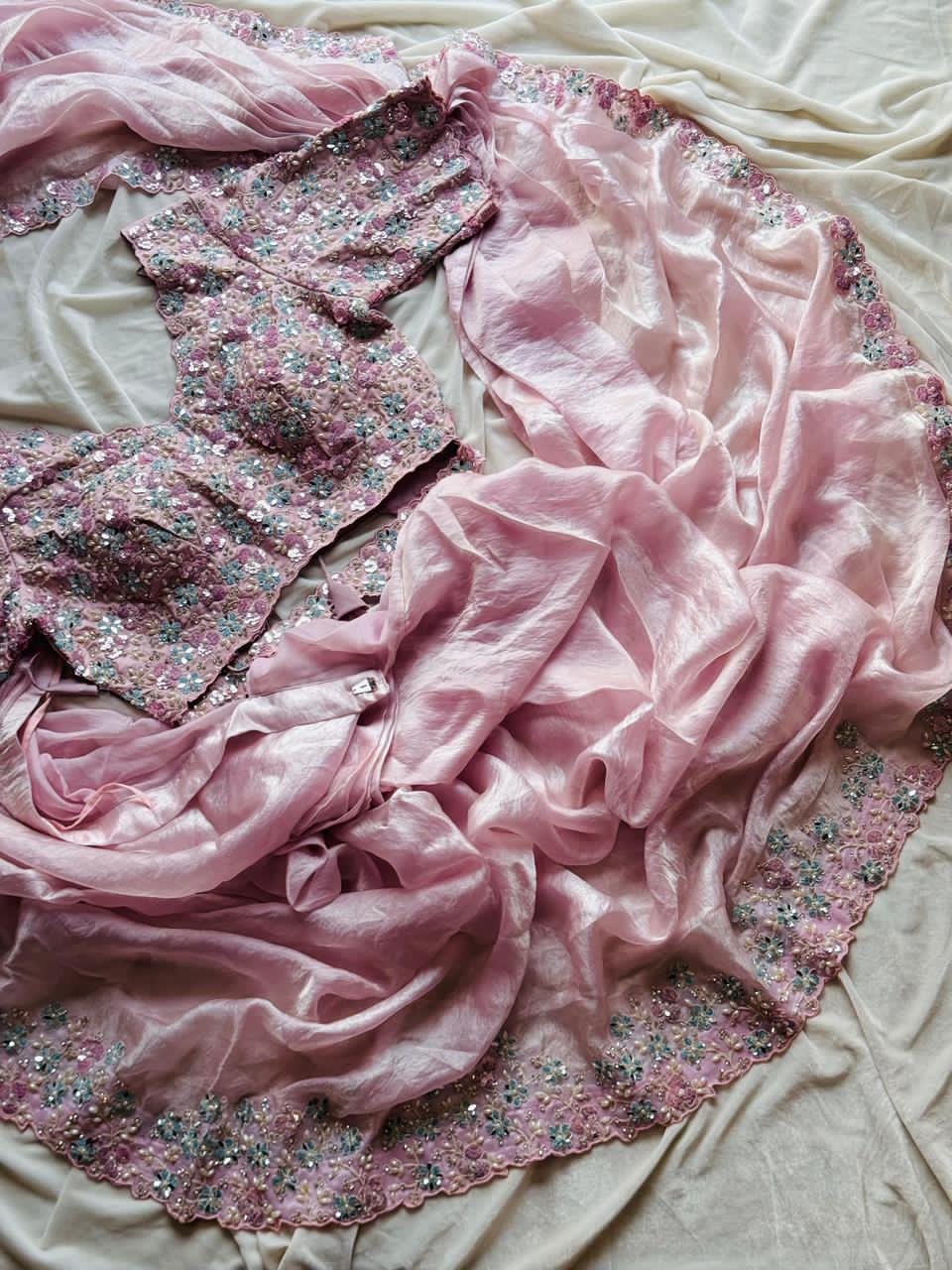 Blush Pink fabric with floral and sequin embellishments on a light background