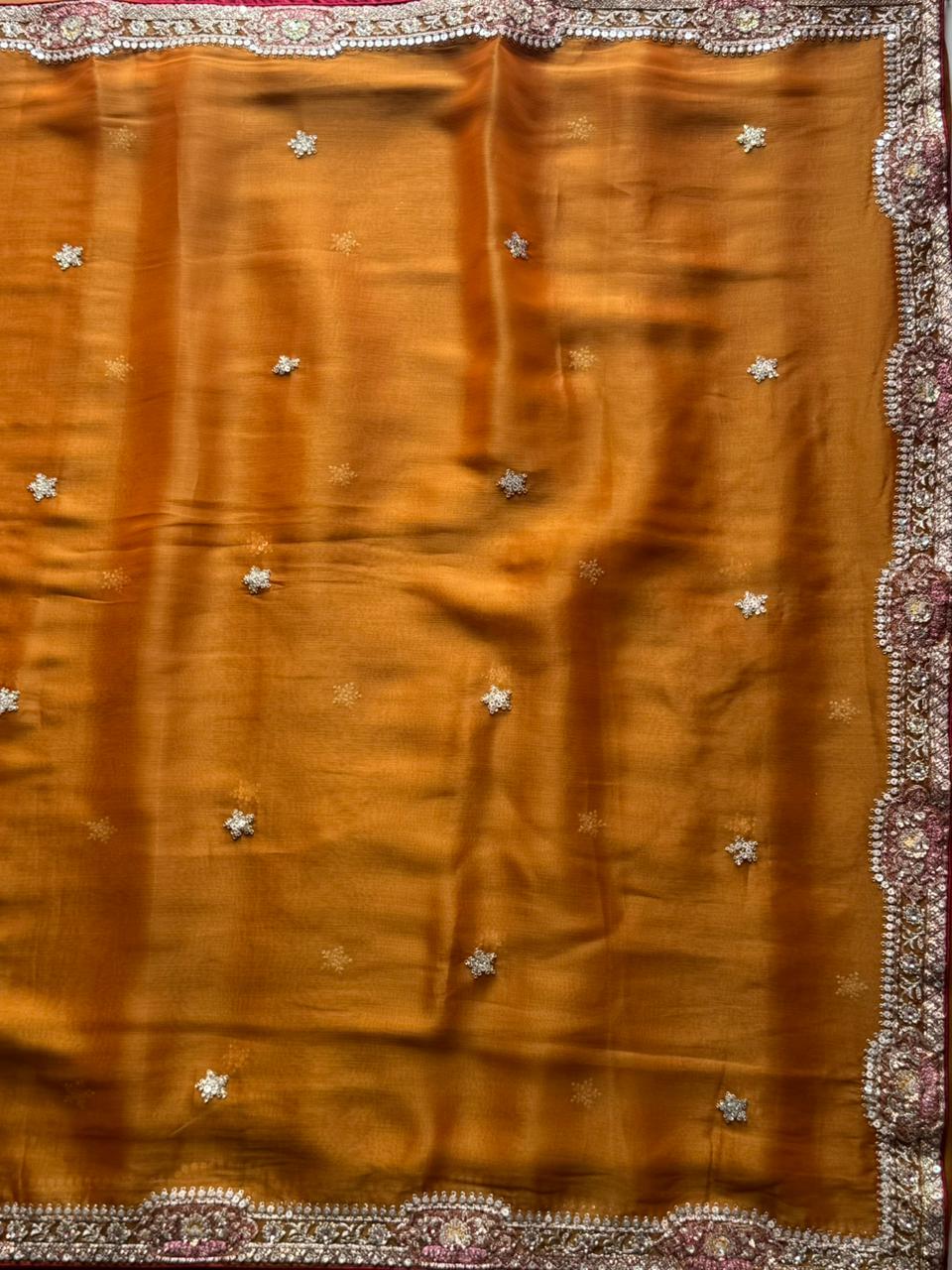 Mustard Yellow fabric with decorative patterns and embellishments