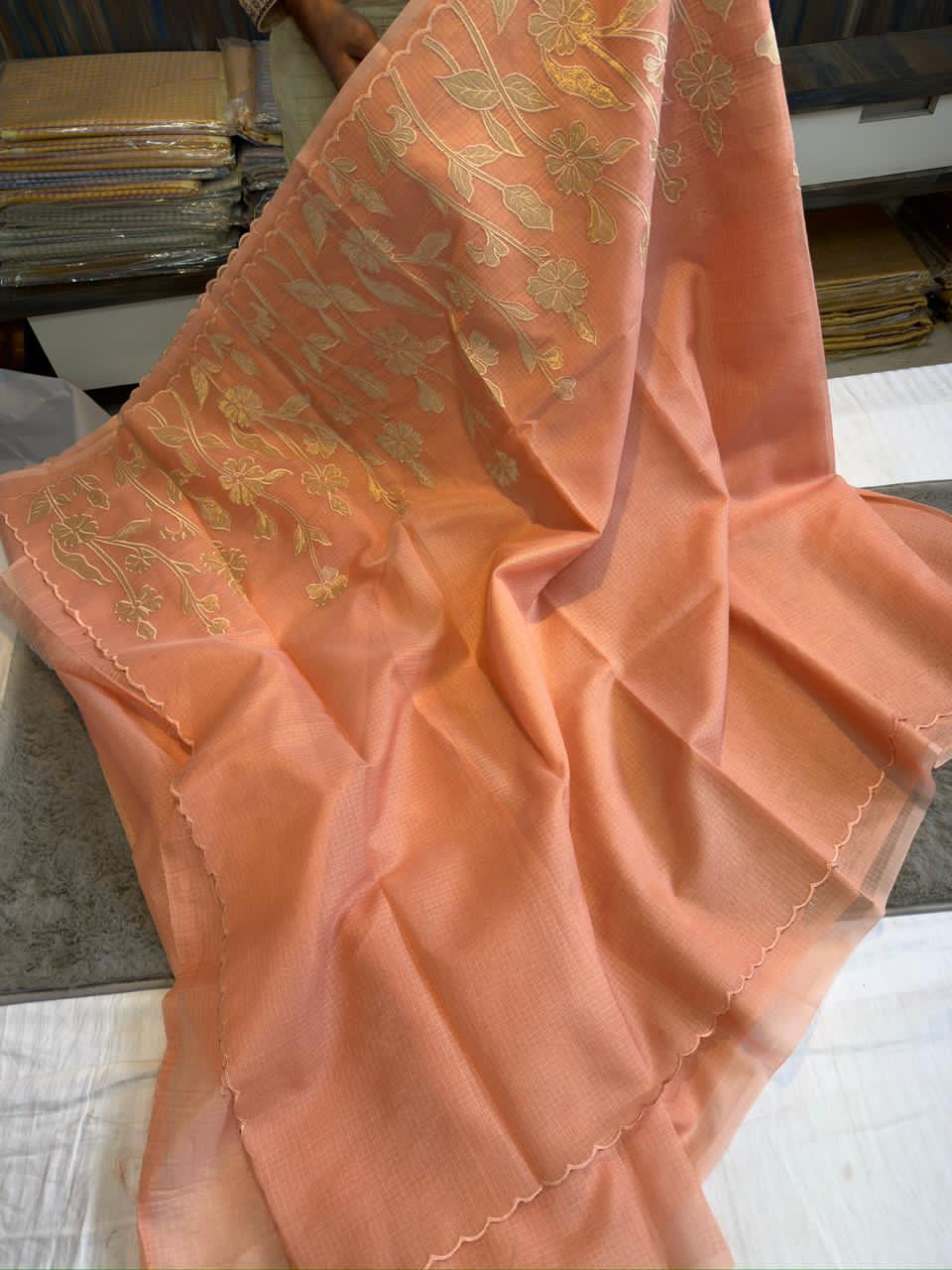 Orange saree with floral patterns 