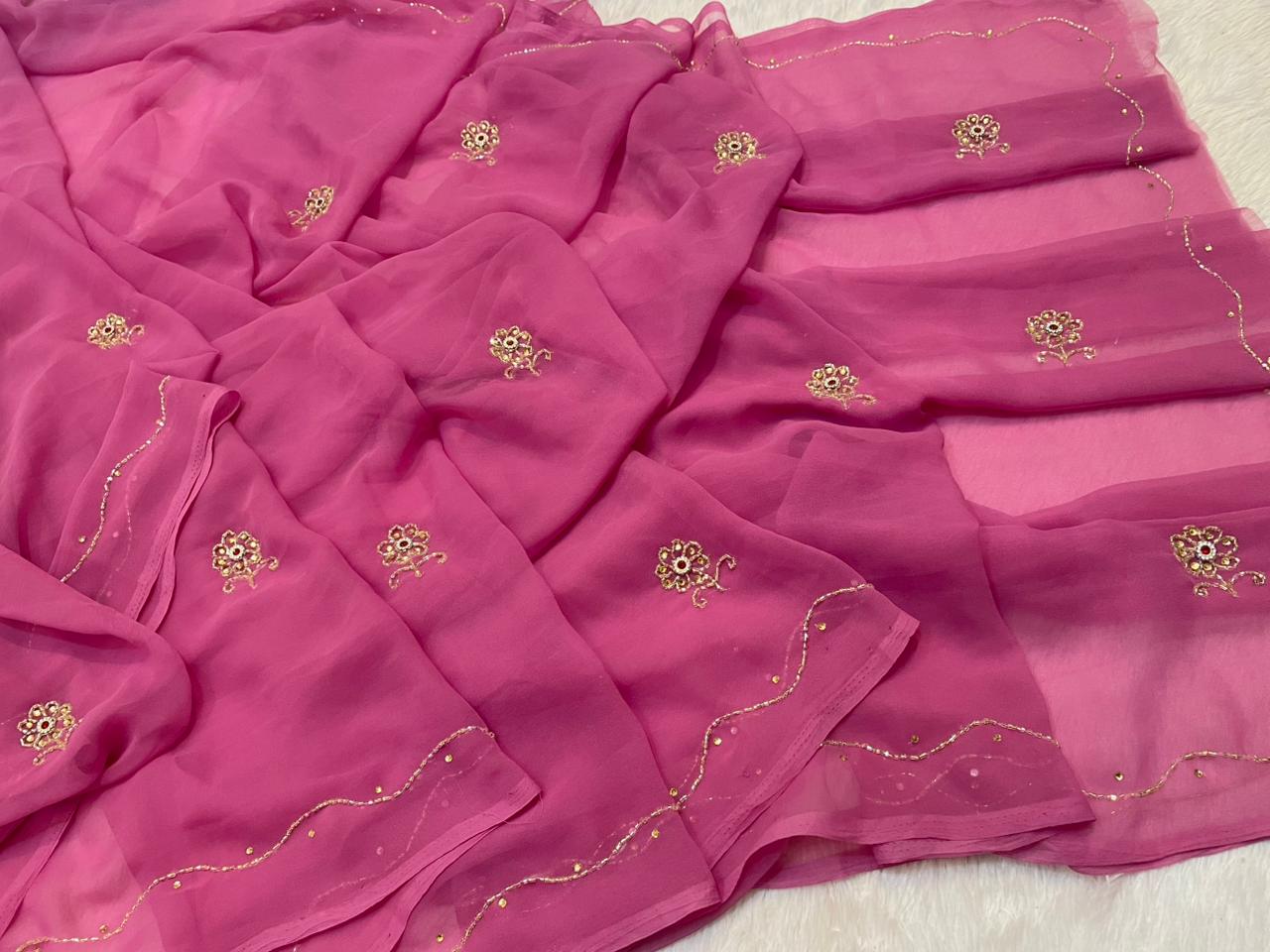 Pink saree with gold embroidery on a background