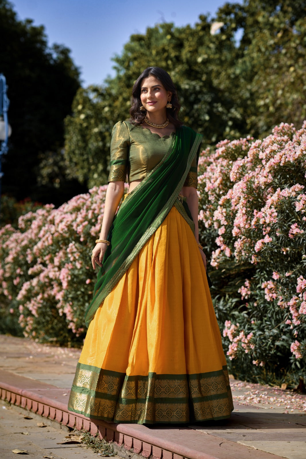 Woman in a Yellow & Green saree 
