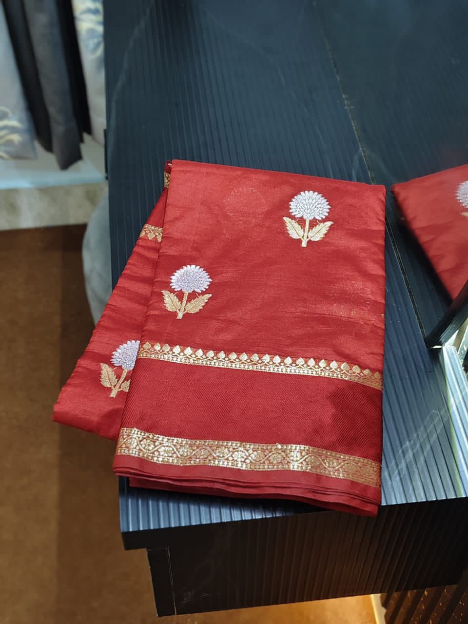 Maroon fabric with floral patterns