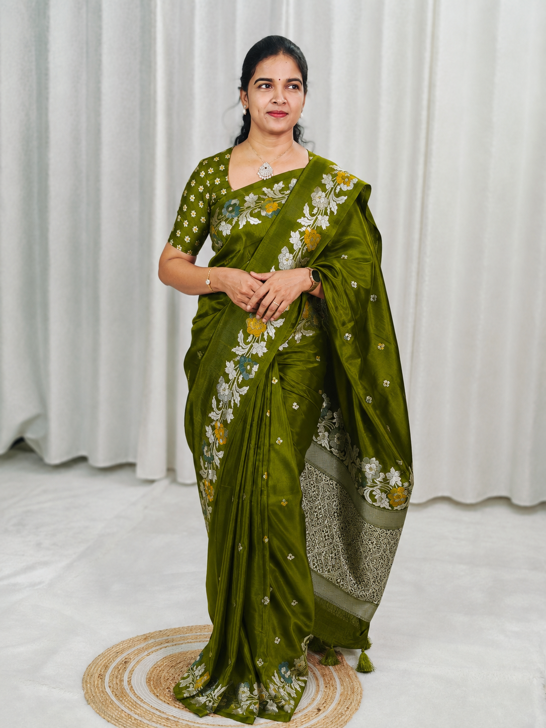 An olive green silk saree 