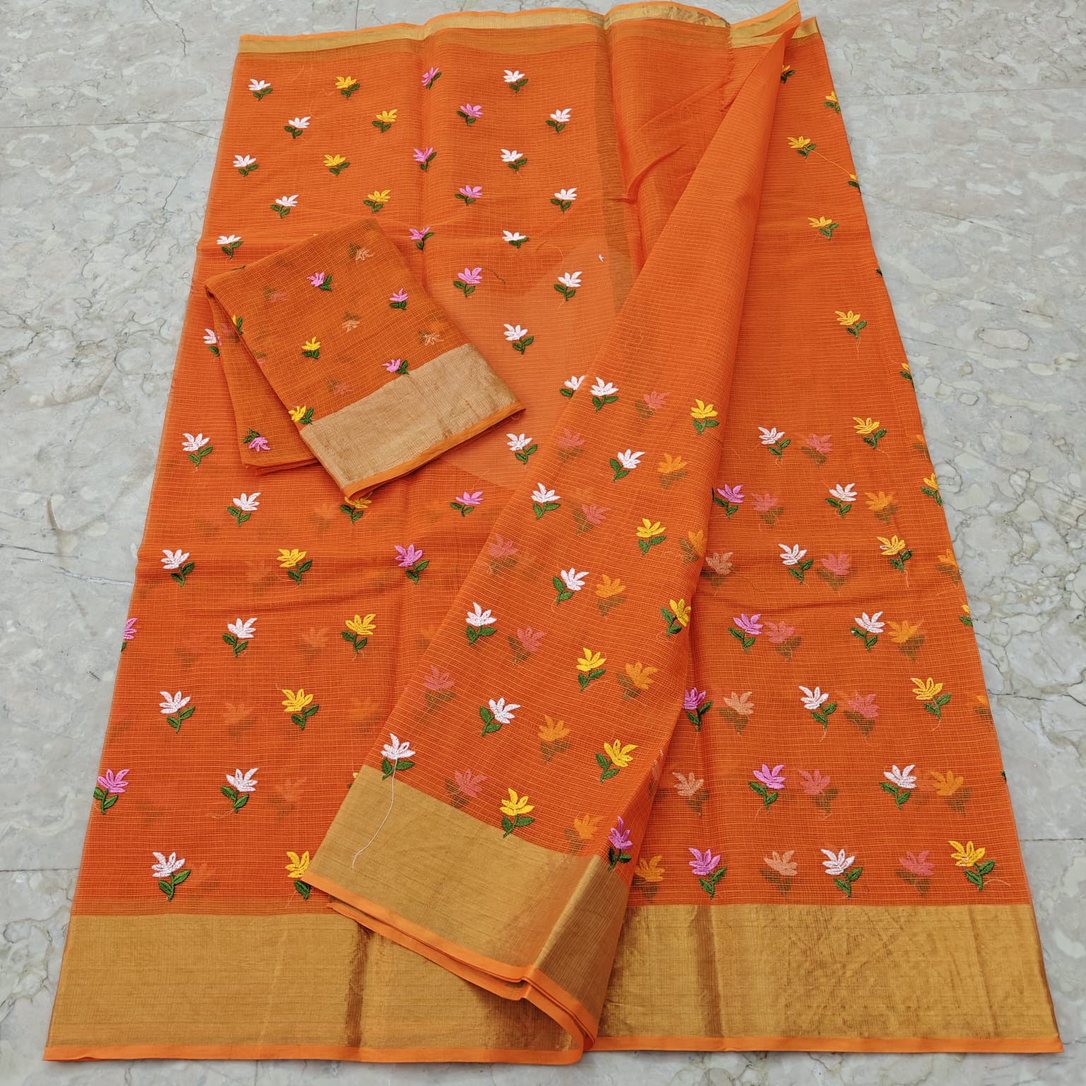Orange fabric with floral patterns