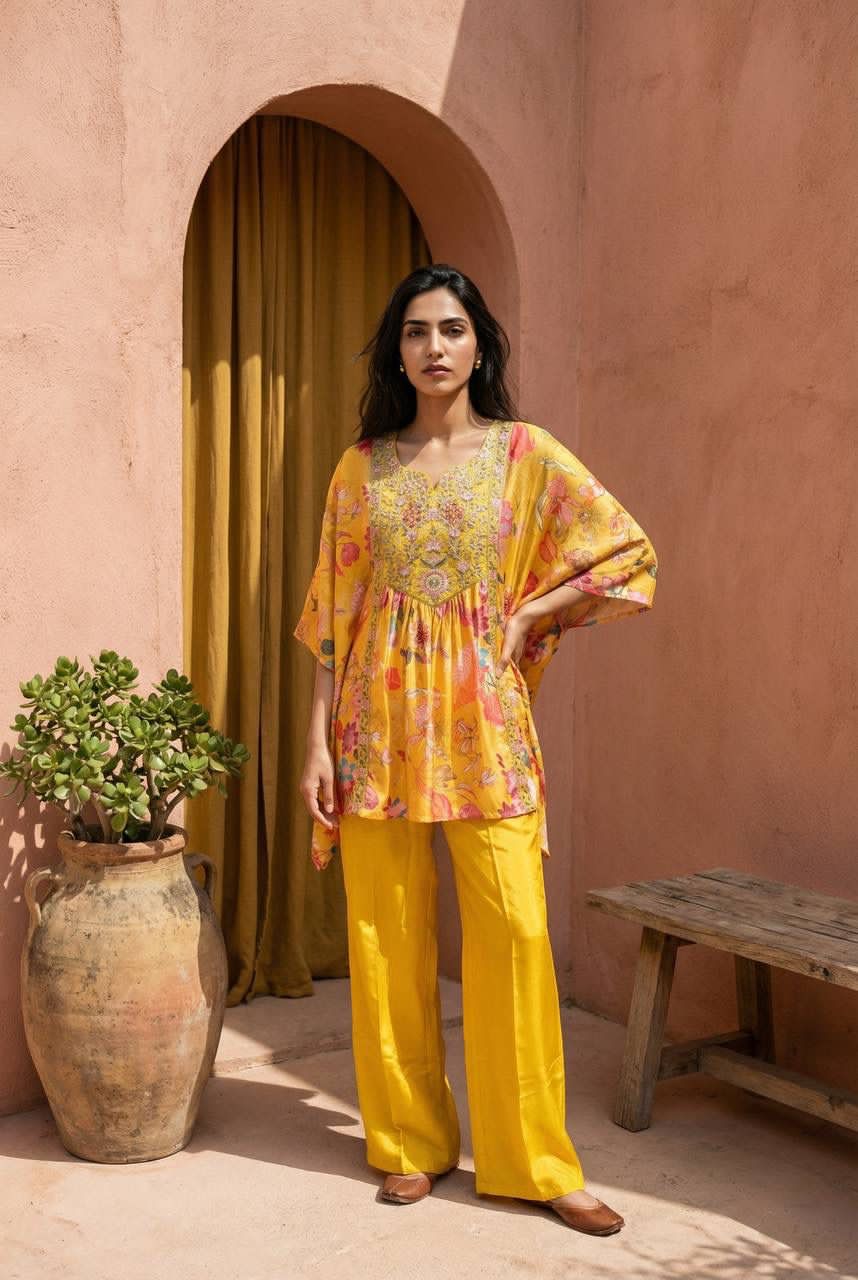 Woman in a yellow outfit standing in front of a wall with an archway.