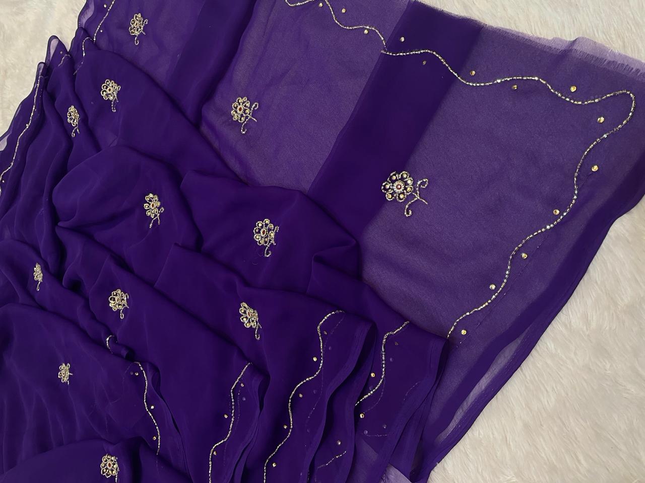 Purple fabric with gold embroidery on a texture surface