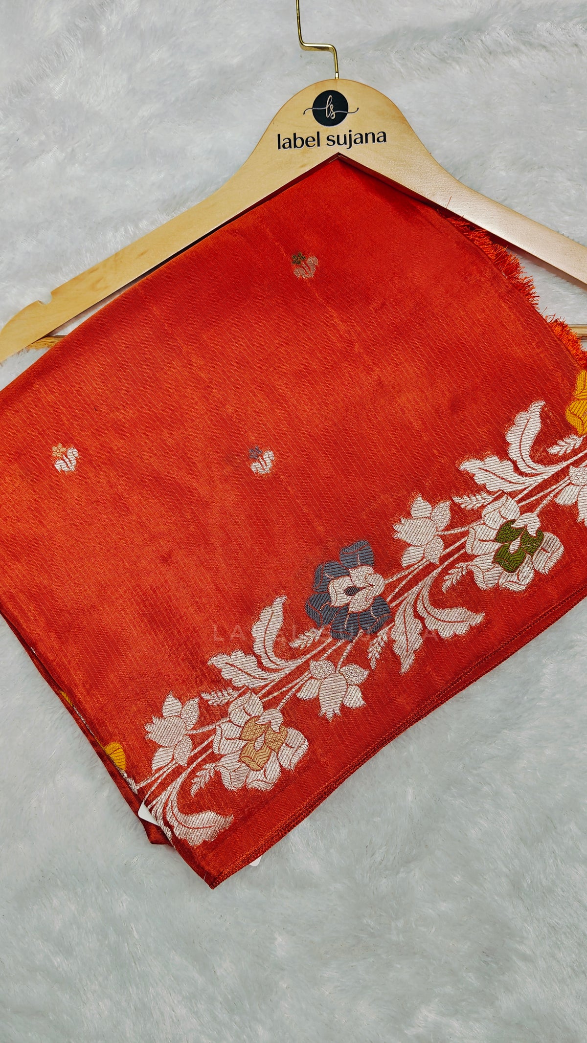 A Rust orange silk saree