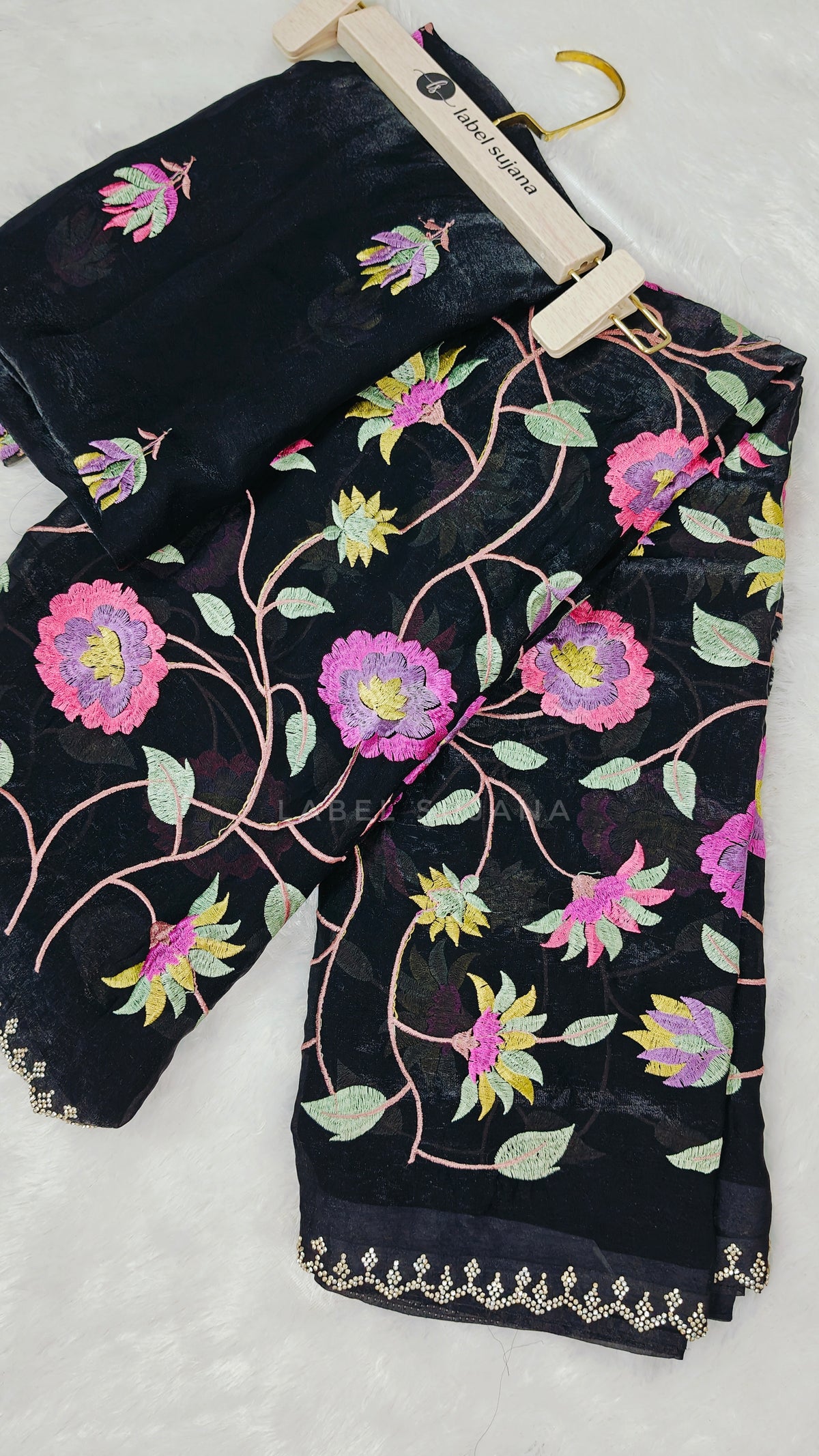 A black embroidery saree with matching blouse