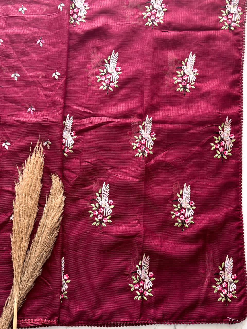 Maroon fabric with white floral embroidery 