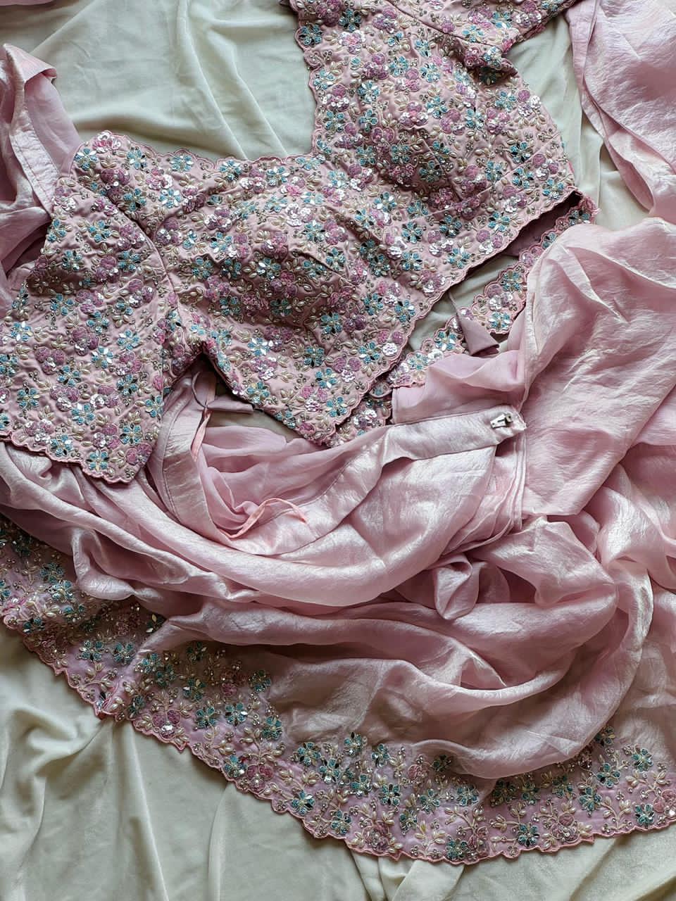 Blush Pink floral lingerie set on a light pink fabric background