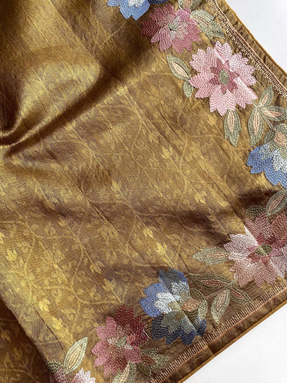 Gold fabric with floral patterns on a background